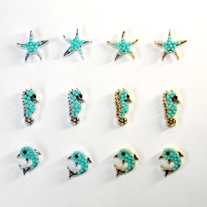 Ocean-themed sea star, seahorse, and dolphin charms with blue beads for DIY bracelets