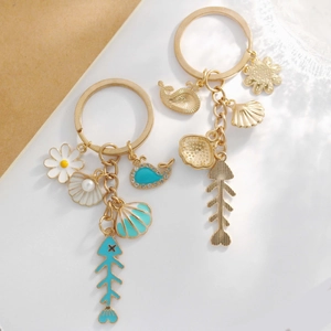 Creative marine keychain with gold starfish shells and enamel whale charms for handbags