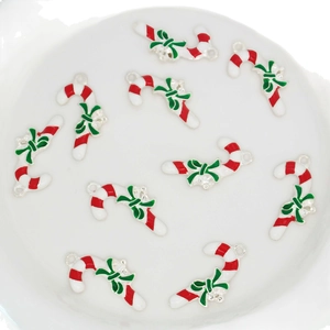 Set of ten festive red and white candy cane pendants with green bows for DIY jewelry
