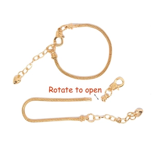 Detailed view of the gold-plated snake chain with a heart pendant and rotate-to-open clasp