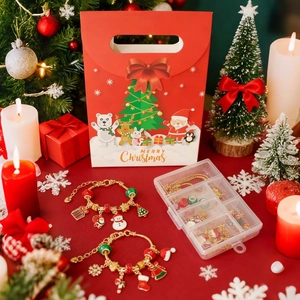 Christmas DIY jewelry gift set with beaded bracelets and holiday charms in a festive bag