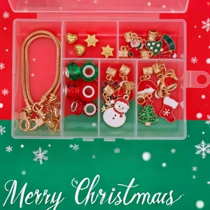 Detailed Christmas DIY jewelry kit with charms and gold snake chain in a storage box