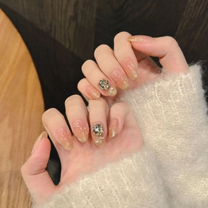 Handmade champagne rose press-on nails with luxury zircon and glitter cat-eye effect