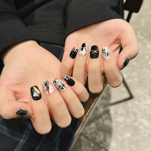 Handmade Black Myth Wukong style press-on nails with silver spider art and metallic chain