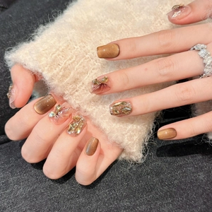 Cat eye butterfly press-on nails with 3D rhinestones and bronze metallic finish