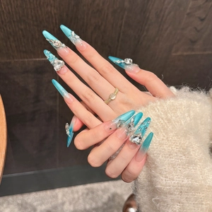 Blaue Katzenaugen Stiletto-Nägel zum Aufkleben mit Strasssteinen und Herz-Schleifen