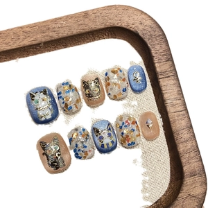 Handmade Egyptian cat press-on nails with dark blue, pink, and glitter foil accents