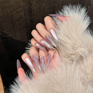Lavender cat eye press-on nails with silver French lines and 3D rhinestones