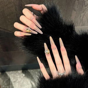 Extra long almond press-on nails with nude aurora gradient and luxury rhinestone accents