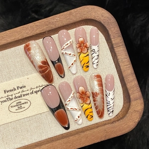 Handmade leopard press-on nails with 3D flower carvings and amber gradient finish