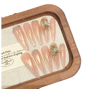 Nude pink aurora gradient press-on nails with luxury crystal and pear-shaped rhinestones
