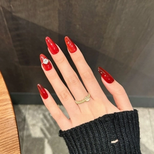 Elegant red cat eye stiletto press-on nails with rhinestone and luxury velvet finish
