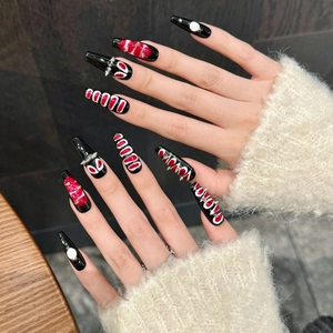 Gothic black coffin press-on nails with red blood marble texture and silver cone studs