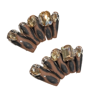 Luxurious matte leopard print coffin nails with champagne K9 crystals and rhinestones