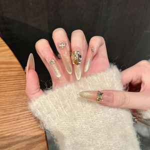 Faux ongles faits main œil de chat ambre avec papillons 3D et strass brillants