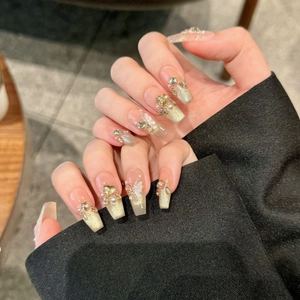 Champagne cat eye press-on nails with 3D gold butterflies, pearls and rhinestones