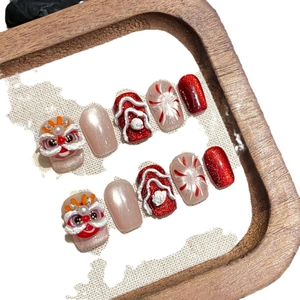 Handmade 3D red lion dance press-on nails with cat eye effect and glitter details