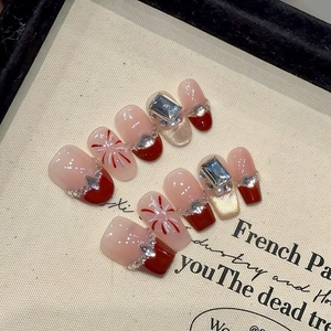 Red cat-eye French gradient press-on nails with glitter fireworks and 3D rhinestones