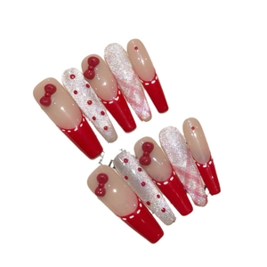 Handmade red polka dot press-on nails with 3D bows and silver glitter in coffin shape