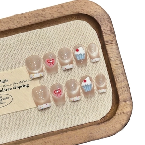 French smile cat eye press-on nails with 3D cupcake and pink heart bow accents