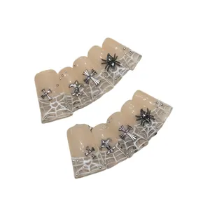 French spider web press-on nails with silver cross and gothic spider metal charms