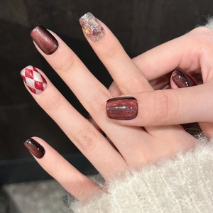 Cat eye wine red press-on nails with hand-painted diamond patterns and 3D butterflies