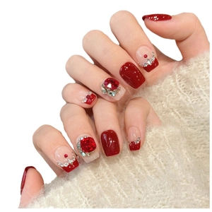 Deep red cat eye press-on nails with luxury rhinestones and elegant french design