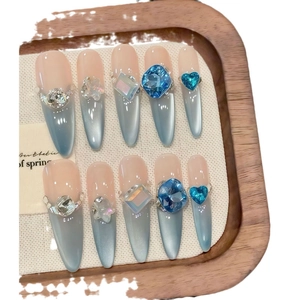 Aquamarine blue cat eye press-on nails with 3D gems and French gradient glitter finish