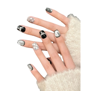 Short black and silver press-on nails with cat eye finish and pearl diamond accents