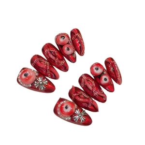 Dark red punk press-on nails with 3D eye details and silver cross metal chains