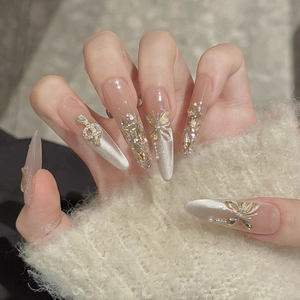 Luxurious Stiletto press-on nails with golden butterfly, pearls and cat-eye glitter finish