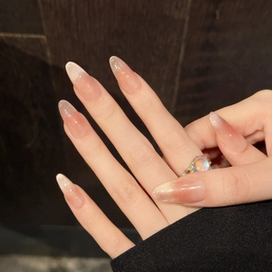 Pink cat eye gradient press-on nails in long almond shape with shimmer finish