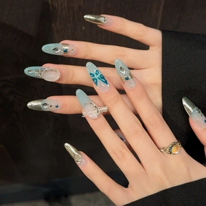Ice blue butterfly handmade press-on nails with silver metallic trim and rhinestones