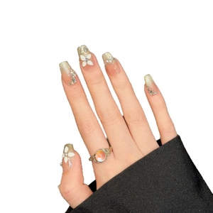 Handmade cat eye press-on nails with 3D white floral petals and gold glitter gradient