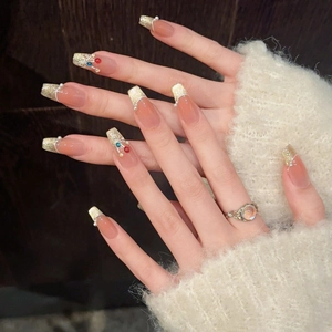 Cat eye press-on nails with colorful pearls and gold glitter on a nude base