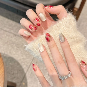 Handmade cherry red cat eye press-on nails with sparkling star and floral hand-painted art