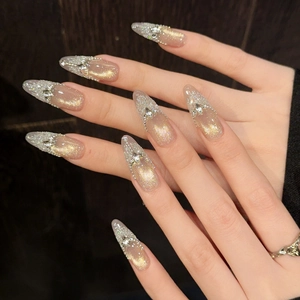 Golden cat eye long almond press-on nails with luxury rhinestones and silver glitter