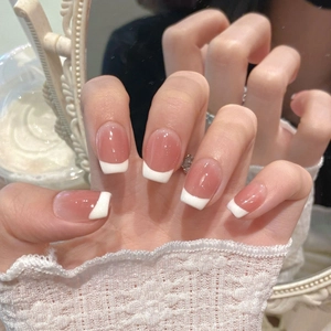 Classic French ombre press-on nails in creamy nude pink with white tips on square shape
