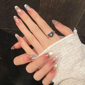 Sparkly cat eye almond press-on nails with pink gradient and glitter tip decoration