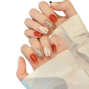 Short square pumpkin orange mirror press-on nails with gold foil and tweed texture