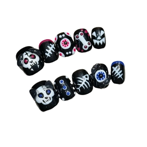 Handmade Halloween press-on nails set with 3D skull, pumpkin, and eyeball patterns