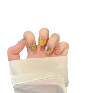 French cat-eye press-on nails with luxury gold glitter and 3D floral gemstone decorations