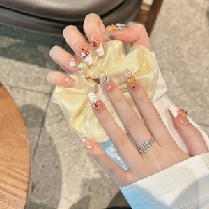 Handmade Capybara press-on nails in long coffin shape with 3D bear and star charms