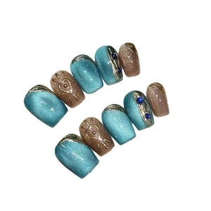 Cat eye press-on nails with blue magnetic finish and vintage silver 3D relief heart