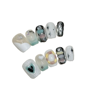 Handmade Y2K press-on nails with 3D hearts, icy blue cat eye finish, and silver accents
