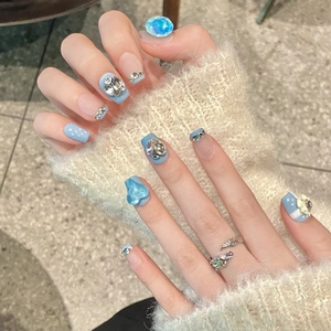 Blue French press-on nails with 3D heart, floral accents and sparkling rhinestones