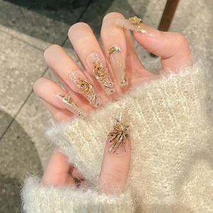 Luxurious handmade press-on nails featuring autumn butterfly motifs and 3D crystal accents