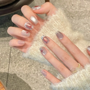 Silver cat eye press-on nails with red star accents in short square-oval shape