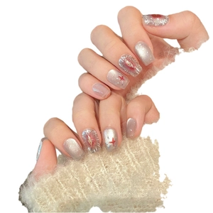 Silver cat eye handmade press-on nails with red star patterns and glitter details