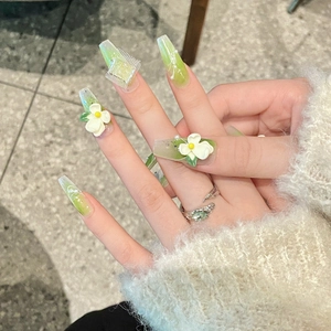 Long trapezoid press-on nails with green gradient, 3D floral accents and pearls